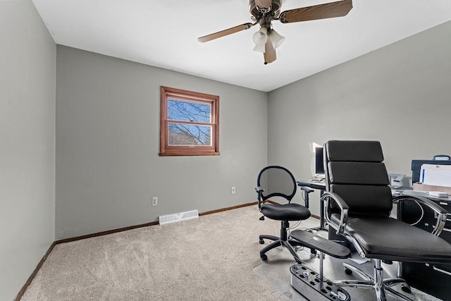 home office featuring carpet and ceiling fan