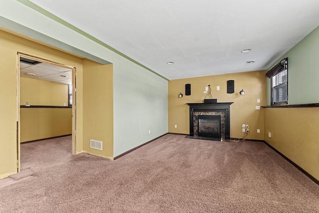 unfurnished living room with carpet flooring