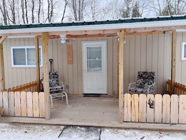 doorway to property with metal roof