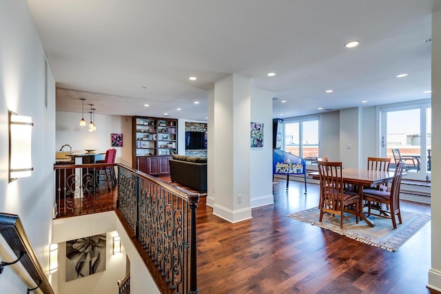 interior space with dark hardwood / wood-style floors and built in shelves