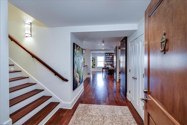 foyer with dark hardwood / wood-style floors