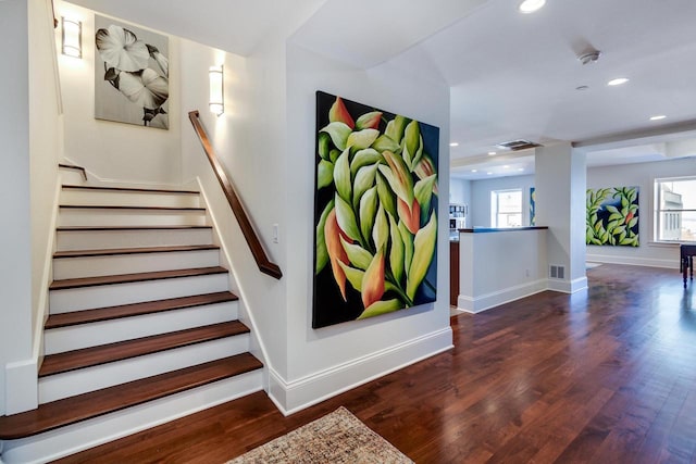 staircase featuring wood-type flooring