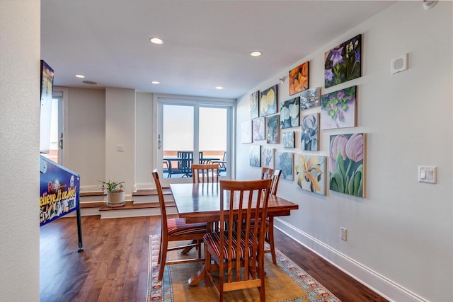 dining space featuring wood-type flooring