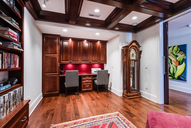 office with built in desk, dark hardwood / wood-style flooring, coffered ceiling, crown molding, and beam ceiling