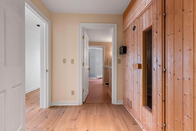 hall with light hardwood / wood-style flooring