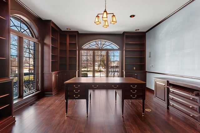 office space featuring dark wood-type flooring and built in features