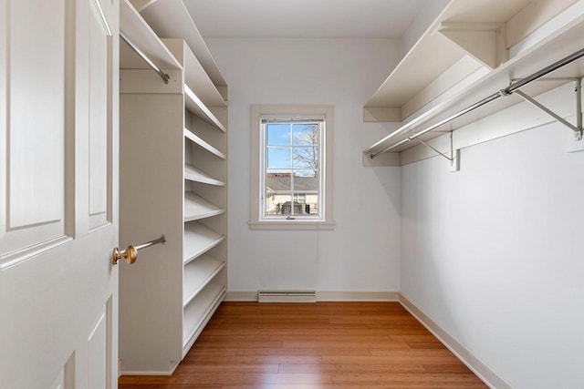 walk in closet featuring light wood-type flooring