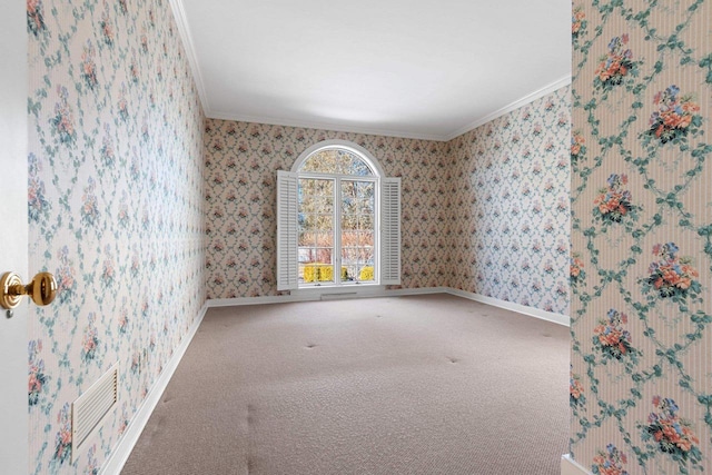 carpeted spare room with crown molding