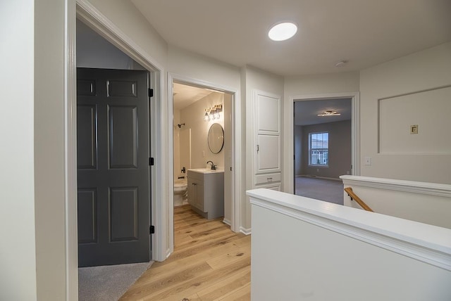 bathroom featuring vanity, toilet, and hardwood / wood-style floors