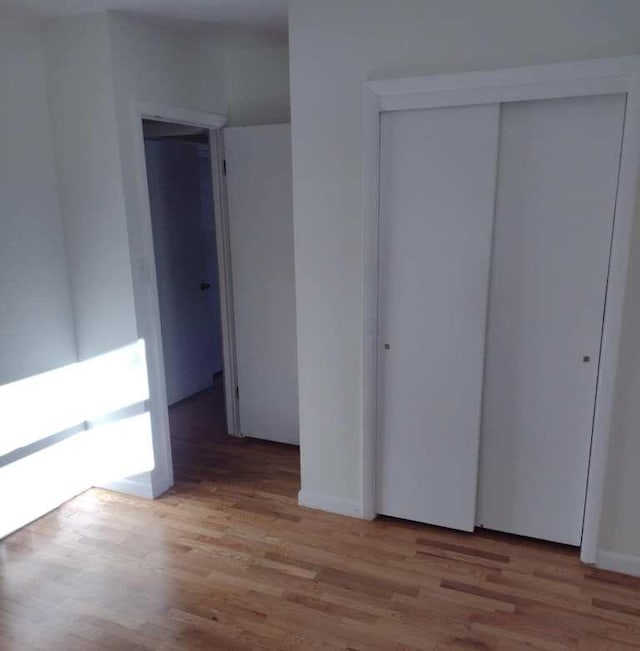 unfurnished bedroom featuring light hardwood / wood-style floors