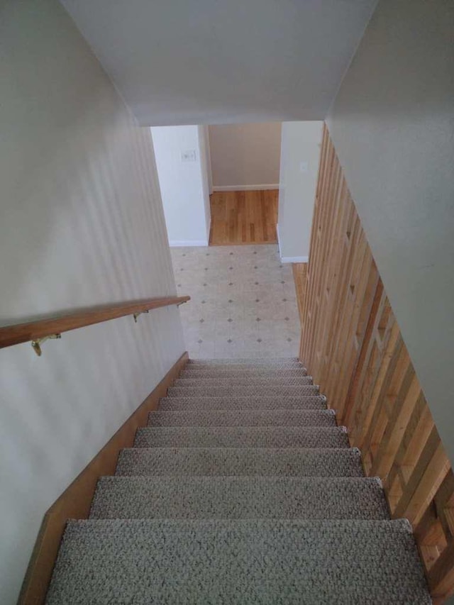 stairway with wooden walls