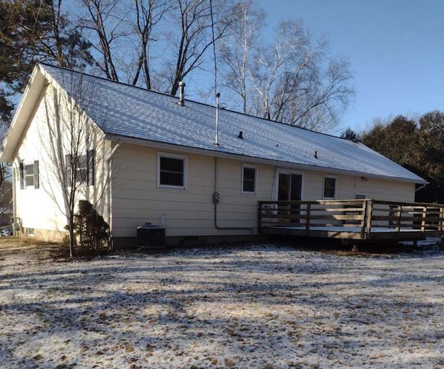 back of property with cooling unit and a deck