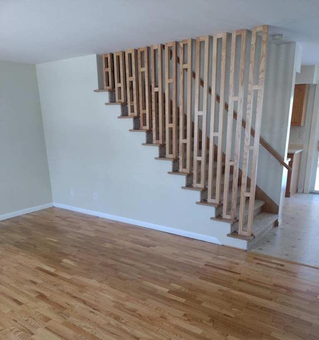 stairway with wood-type flooring