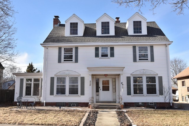 colonial inspired home with a front yard