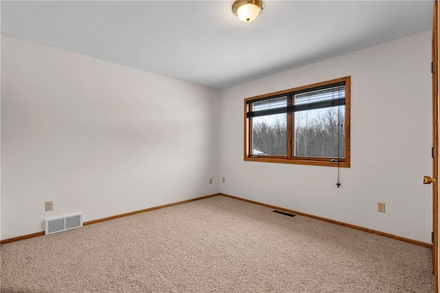 empty room featuring carpet flooring