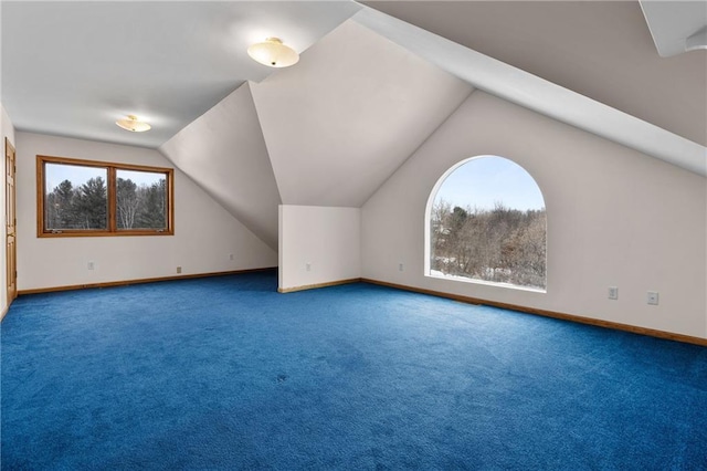 bonus room featuring carpet flooring and vaulted ceiling