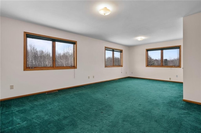 empty room with dark carpet