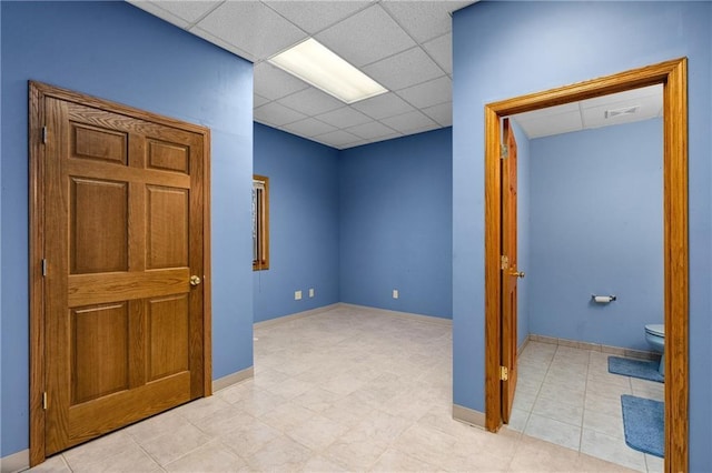 interior space featuring a paneled ceiling