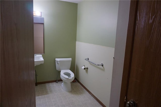 bathroom featuring toilet