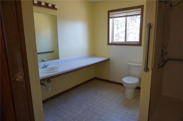 bathroom featuring sink and toilet