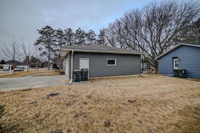 back of house featuring a garage