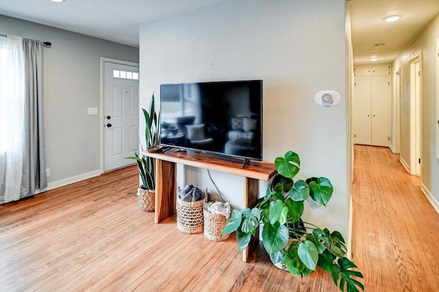 living room with light hardwood / wood-style floors