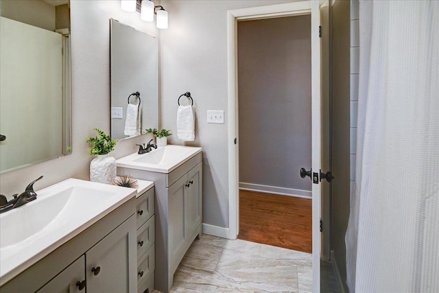 bathroom featuring vanity and a shower with shower curtain