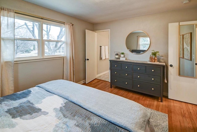 bedroom with light hardwood / wood-style flooring