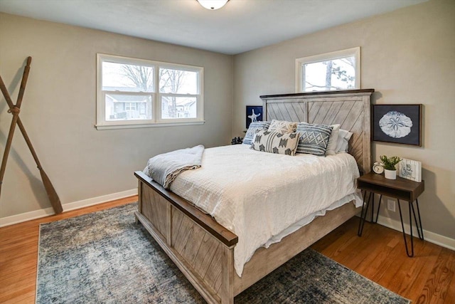 bedroom with hardwood / wood-style floors