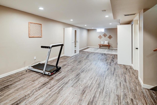 workout area with light wood-type flooring