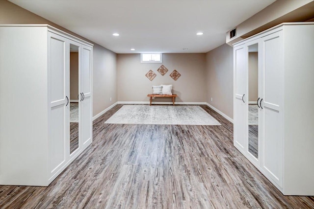 interior space with hardwood / wood-style floors