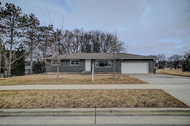 view of front of home with a garage and a front yard