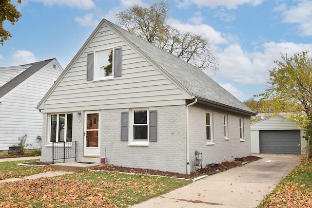 view of front of property featuring a garage, an outdoor structure, and covered porch