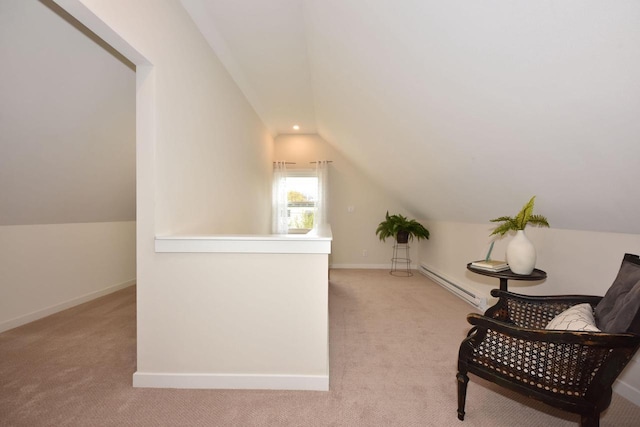 additional living space featuring a baseboard radiator, vaulted ceiling, and light carpet