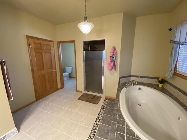 bathroom featuring toilet, a chandelier, tile patterned flooring, and plus walk in shower