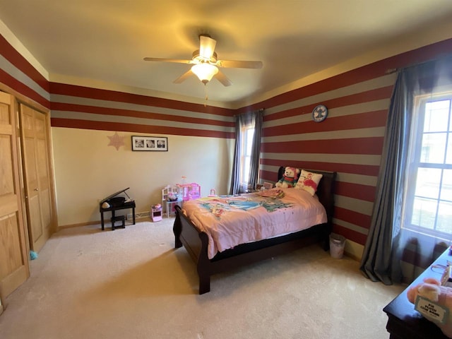 bedroom featuring ceiling fan and light colored carpet