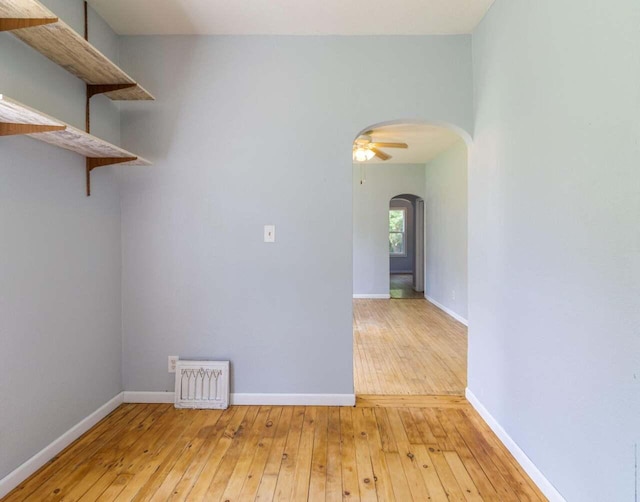 spare room featuring ceiling fan and light hardwood / wood-style flooring