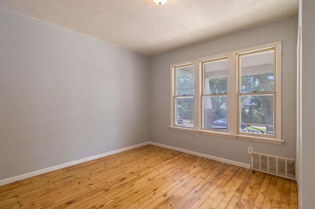 spare room with light wood-type flooring