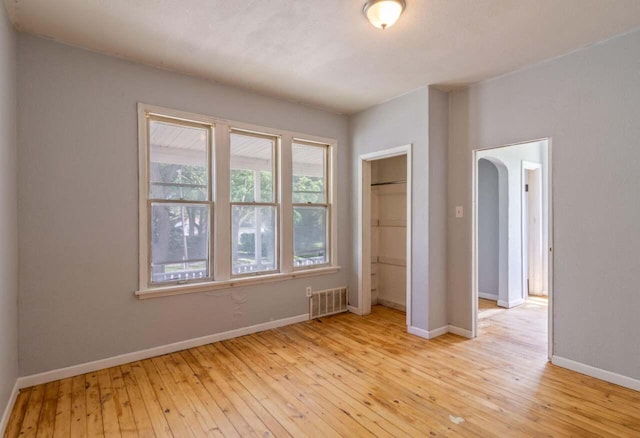 unfurnished room with light hardwood / wood-style floors