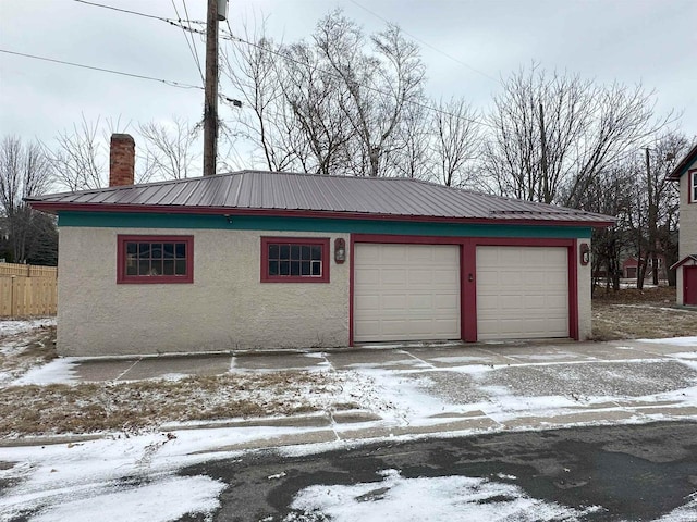 view of snow covered garage