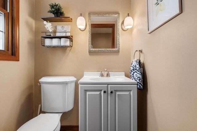 bathroom with vanity and toilet