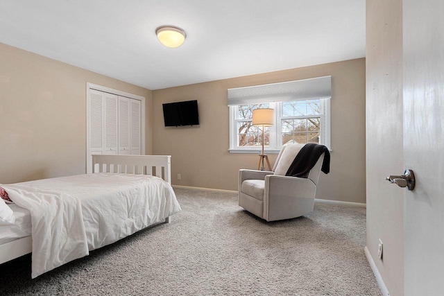 bedroom featuring a closet and carpet