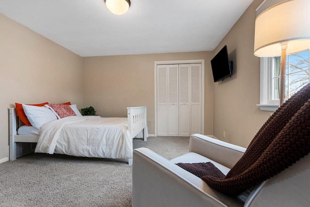 bedroom with carpet and a closet