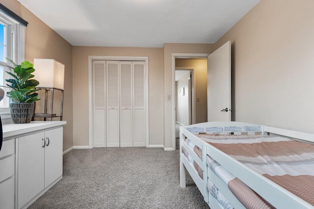 carpeted bedroom with a closet