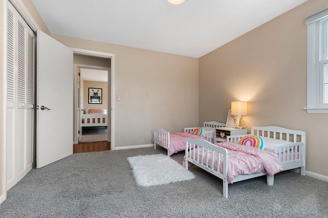 carpeted bedroom with a closet