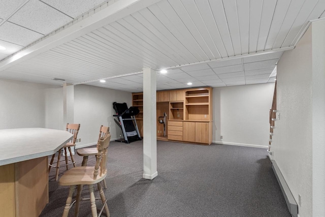 basement with dark carpet