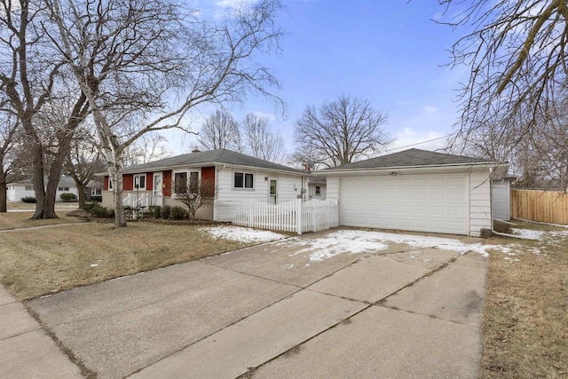 single story home featuring a garage and a front yard