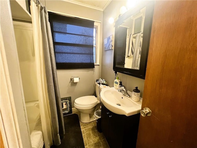 bathroom featuring vanity, crown molding, toilet, and walk in shower