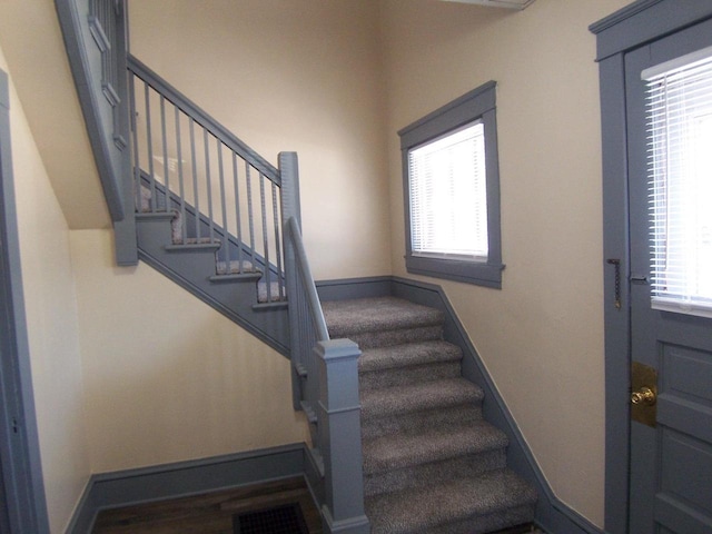 staircase featuring a wealth of natural light