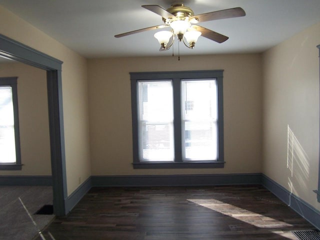 unfurnished room with dark hardwood / wood-style floors